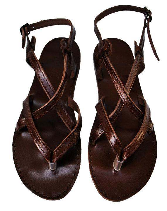 Dark brown sole sandals sky view