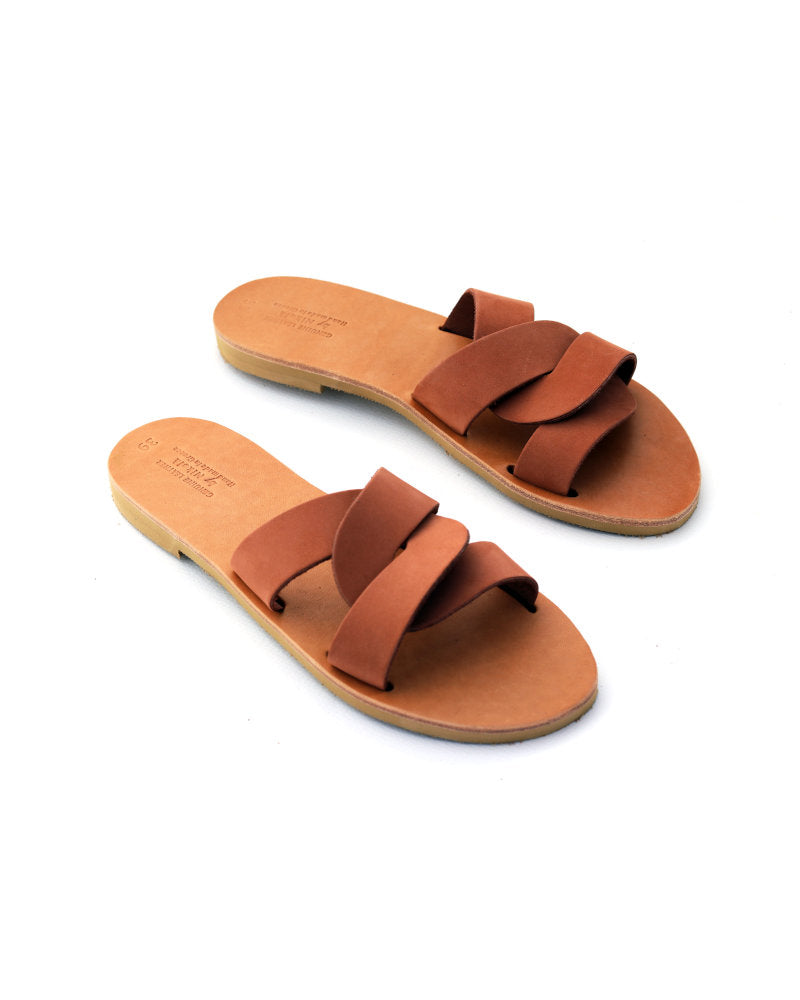 Pair of brown sandals on a white background