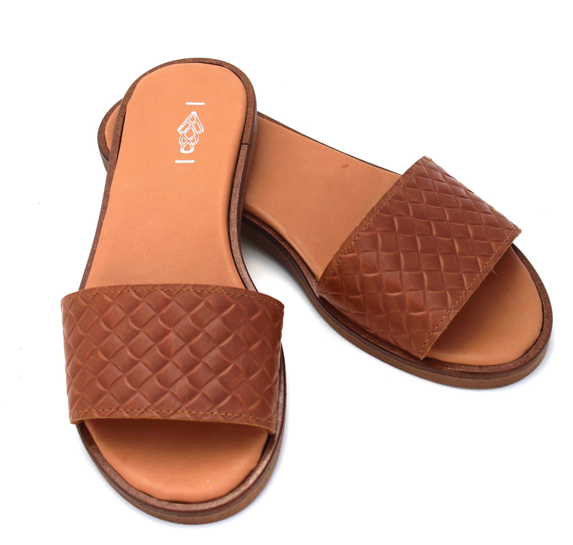 Brown woven slide sandals on a white background