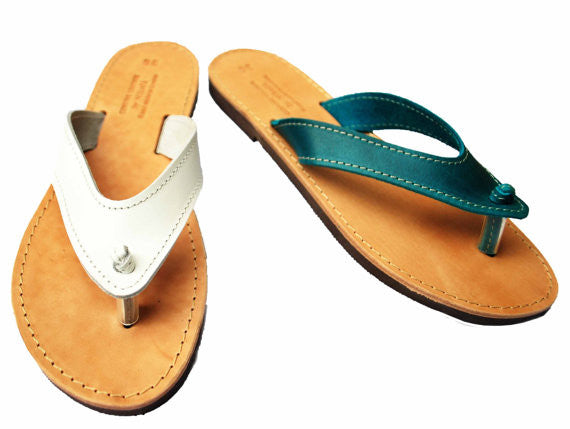 White and turquise flip flops with wide straps