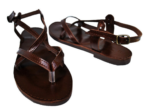 Dark brown sole sandals side view