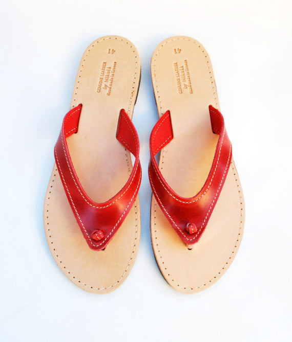 Beach flip flops in red sky view