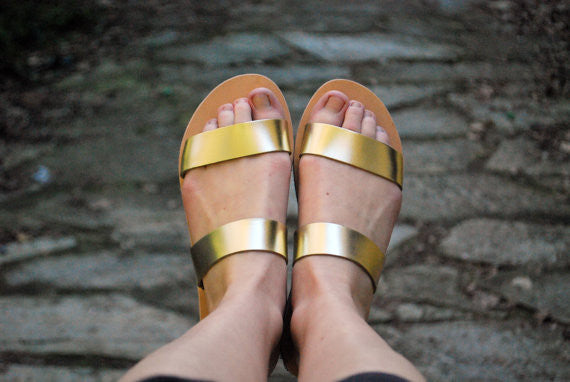 Clio slide sandals in gold color